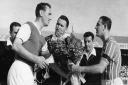 Ipswich Town captain Andy Nelson (left) exchanges flowers with his Floriana counterpart in 1962.