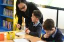 Maths teachers from Shanghai are teaching at Stanton Primary School as part of an exchange programme. Wendy Li talking to one of the pupils    Picture: SARAH LUCY BROWN