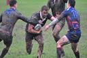 Dan Whiteman charges through the defensive line at Old Haberdashers. Photo: RICHARD PARKER