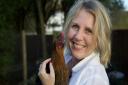 East Anglian food writer Tessa Allingham with one of her seven prized hens, whom she describes as a source 
of absolute joy. Photo: Contributed