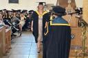 A beaming student at the graduation ceremony Picture: Newsquest