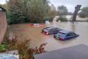 Cars were submerged in The Elms car park when Framlingham Mere burst its banks
