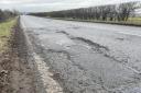 A pothole in a road in Long Melford