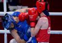 Britain's Charley-Sian Davison, right, exchanges punches with China's Chang Yuan during their women's flyweight 51-kg boxing match at the 2020 Summer Olympics, Thursday, July 29, 2021, in Tokyo, Japan.