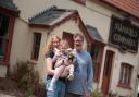 Lex Rudd and Roy Elder with their daughter Eleanore outside their new pub in Stansfield.  Picture: Sarah Lucy Brown