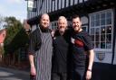 Neil Smith MBE, and his sons Matt and Dan outside their pub The Bell and Steelyard, which is the oldest in Woodbridge