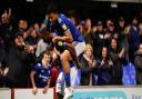 Janoi Donacien and Macauley Bonne celebrate after the victory over Doncaster Rovers