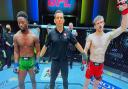 Arnold Allen, right, has his hand raised after beating Sodiq Yusuff in Las Vegas tonight