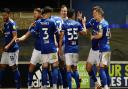 Town players celebrate with Lee Evans after he had scored to take them 2-0 up.