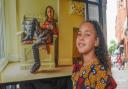 A'naih Marie with her picture, taken by John Ferguson, at the Black Suffolk exhibition at Ipswich Cornhill.