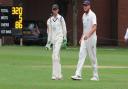 Sudburys Adam Mansfield, left, talks to all-rounder Michael Comber during the match against Lincolnshire at Ipswich School during which he equalled a county record of making 37 dismissals in a season for Suffolk Photograph: NICK GARNHAM