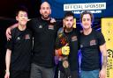 Charlie Falco with his BKK Fighters team after defending his straw-weight title at Cage Warriors Academy South East 29 in Colchester