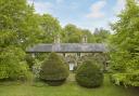 The property was formerly a terrace of three estate cottages