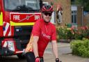 Firefighter Simon Lewis gets on his bike for the Suffolk Fire Ride