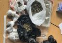 A woman was arrested after a large quantity of cannabis was seized in a police raid