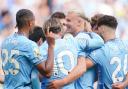 Man City striker Erling Haaland is congratulated after sealing his hat-trick against Ipswich Town.