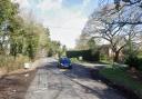 A road near a Suffolk village was blocked after a crash between a lorry and a car.