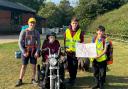 William, Owen and Connor with Aiden, who completed a Duke of Edinburgh expedition on an all-terrain mobility scooter donated by a local firm