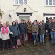 Thelnetham locals outside The White Horse, which is now operating as a community pub