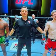 Arnold Allen, right, has his hand raised after beating Sodiq Yusuff in Las Vegas tonight