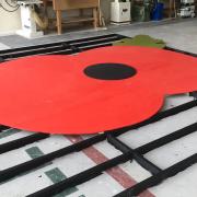 Level two carpentry and joinery students at West Suffolk College have created a seven meter poppy to commemorate Remembrance Day