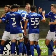 Town players celebrate with Lee Evans after he had scored to take them 2-0 up.