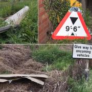 Debris from numerous crashes into the bridge has been left on the sides of the road