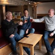 Steve Johnson, Leighton Hammett and Darrin Tompkins enjoying a drink together inside Isaacs for the first time in a year.