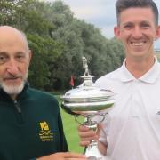 David Southgate receives the Coronation Cup from Felixstowe Ferry captain Graham Popple. Picture: TONY GARNETT