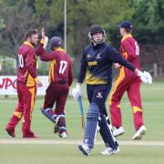 Jake Foley, second left, is congratulated by captain Adam Mansfield after taking one of his five wickets in the first T20 versus Norfolk on Monday. Photograph: NICK GARNHAM