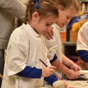 Children from Fairfield Infant School join the mayor Graham Newman in painting stones with poppies for Remembrance Day to raise money for the RBL.
 Picture: SONYA DUNCAN