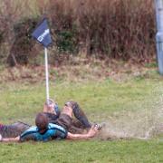 Anwar Bouilouta scores for Wymondham in their wet win over Woodbridge. Picture: SIMON BALLARD