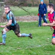 Woodbridge's Adam Plummer crosses at Wisbech. Picture: SIMON BALLARD