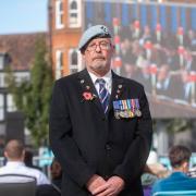 The streets of Ipswich were silent on Monday morning as over one hundred people gathered at the Cornhill to watch the funeral procession of Her Majesty The Queen.