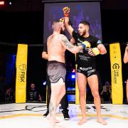 Tariq Pell has his hand raised after earning a second round submission win over Harry Davies at Cage Warriors Academy South East 30 in Colchester