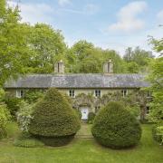 The property was formerly a terrace of three estate cottages