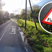 Two people have been rescued from their car after it got trapped in flood water in Glemsford