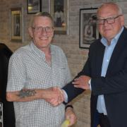 Danny Davey - overall winner get his prize from former EADT editor Terry Hunt