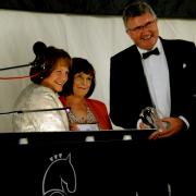Lady Clare Euston hands the King's Award to Sally Bendall and Bill Baker