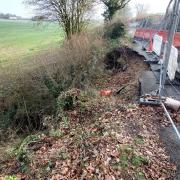 Work to repair the collapsed road was due to start in July, but has now been delayed