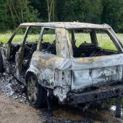 Pictures show a car damaged in a vehicle fire near Woodbridge