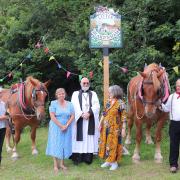 Ms Kenningale is pictured in the blue dress alongside Rev Eric Fall with Marcia Blakenham and the owners of the horses, Hazel Chapman and John Latham