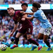 Ipswich Town defender Leif Davis goes down in the Manchester City box when sandwiched by Rico Lewis and Savinho - but no penalty was given and no VAR used.