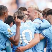 Man City striker Erling Haaland is congratulated after sealing his hat-trick against Ipswich Town.