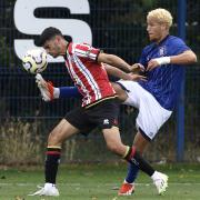 Rio Morgan battles for the ball against Sheffield United.