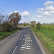 A road near a Suffolk town is currently blocked following a collision between two cars.