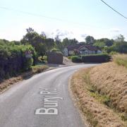 A person has escaped without injury after their car overturned on a bend near a village.