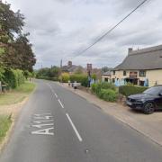 A person is in hospital after a crash between a car and a trailer near a Suffolk village.