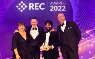 Laurence Johnson (centre left) and Gurmail Singh of Seven Resourcing collect the Best Company to work for (up to 150 employees) award from REC Awards 2022 host Kerry Godliman and Adrian Wightman of award sponsor Severn Trent