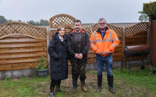 Mark Stannard (right) with neighbours in Foxglove Avenue who were flooded during recent storms